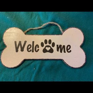 Wooden dog bone shaped welcome sign